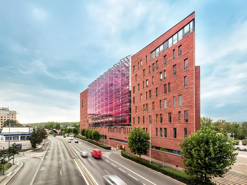 Danube House Prague featuring triangular design with red sandstone facade and natural bed face cladding
